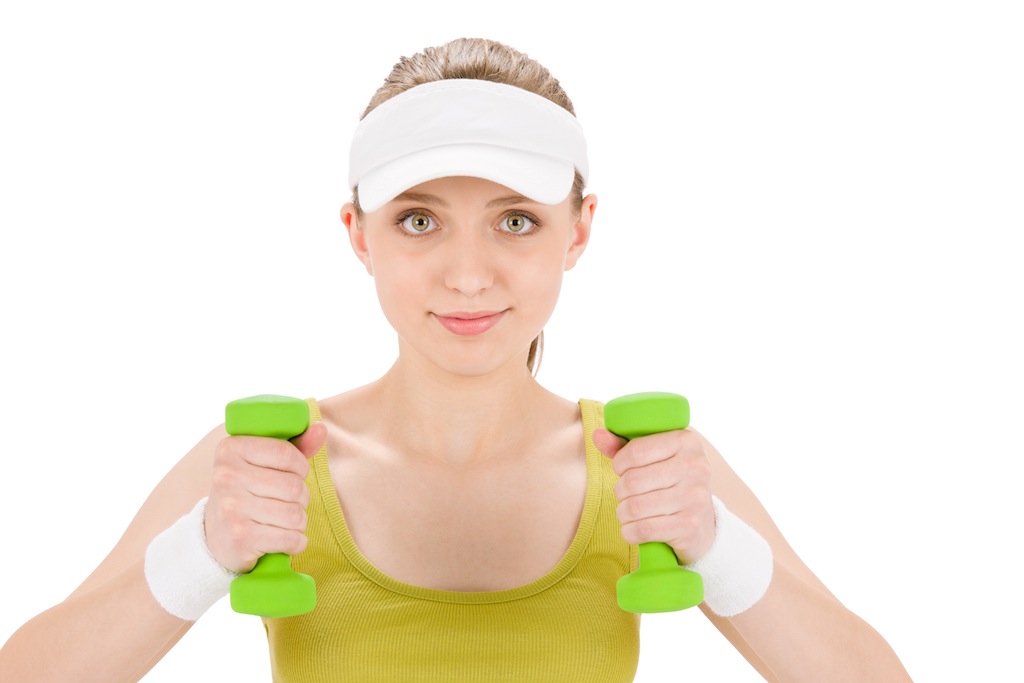 Fitness teenager woman with dumbbell in sportive outfit