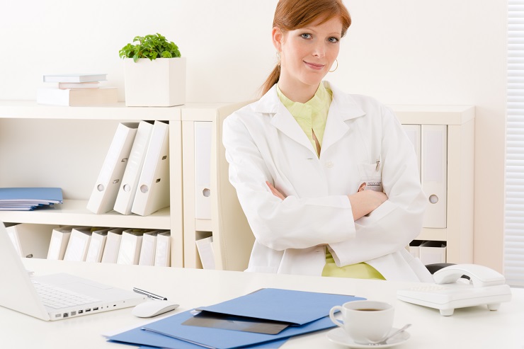 Doctor office - portrait female physician sit by desk